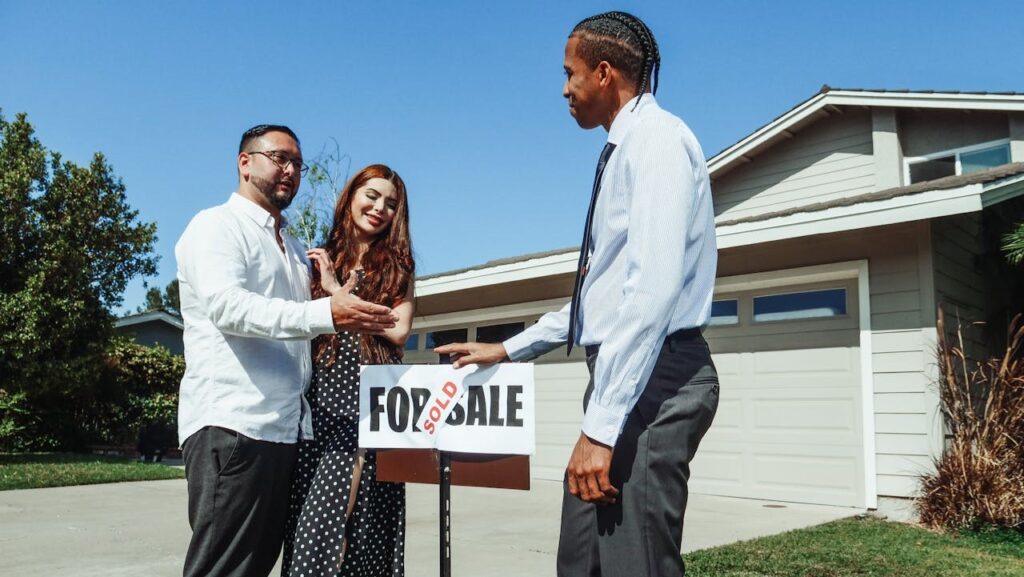 A man and women securing an asset and purchasing their first duplex property.