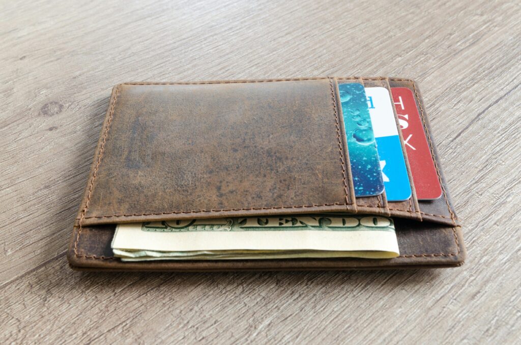 Wallet with credit cards and money.